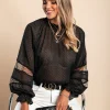 Elegante blusa in tessuto semitrasparente a pois Geltra, nera