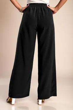 Pantaloni lunghi eleganti con bottoni, neri.